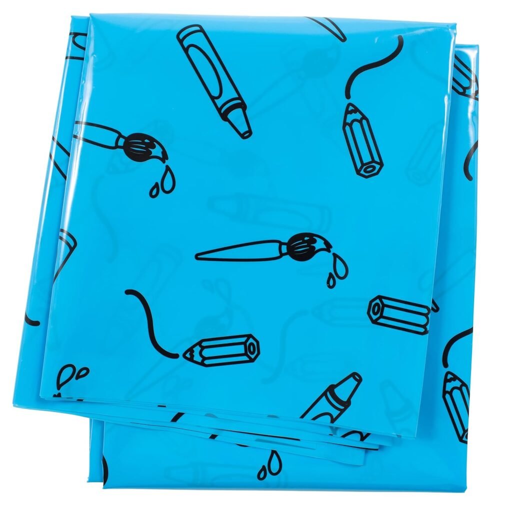Folded blue waterproof splat mat with submarine and marine patterns for toddler play